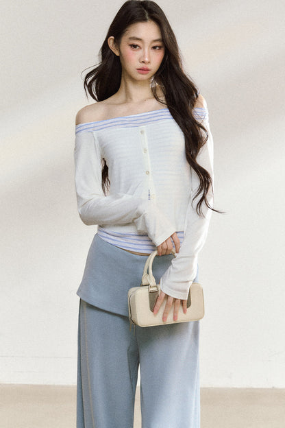 Completo con top a maniche lunghe con spalle scoperte e pantaloni ampi