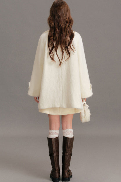 Manteau mi-long en laine imitation vison à épaules tombantes