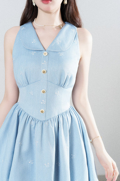 Blaues ärmelloses Kleid mit Reverskragen, Spitzeneinsatz und Rüschen