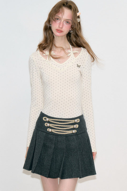 Maglione a maglia a pois con scollo all'americana