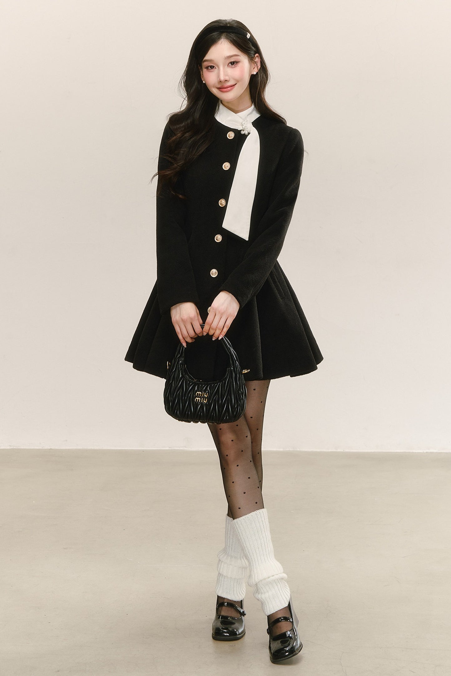 Abito cappotto imbottito in lana nero