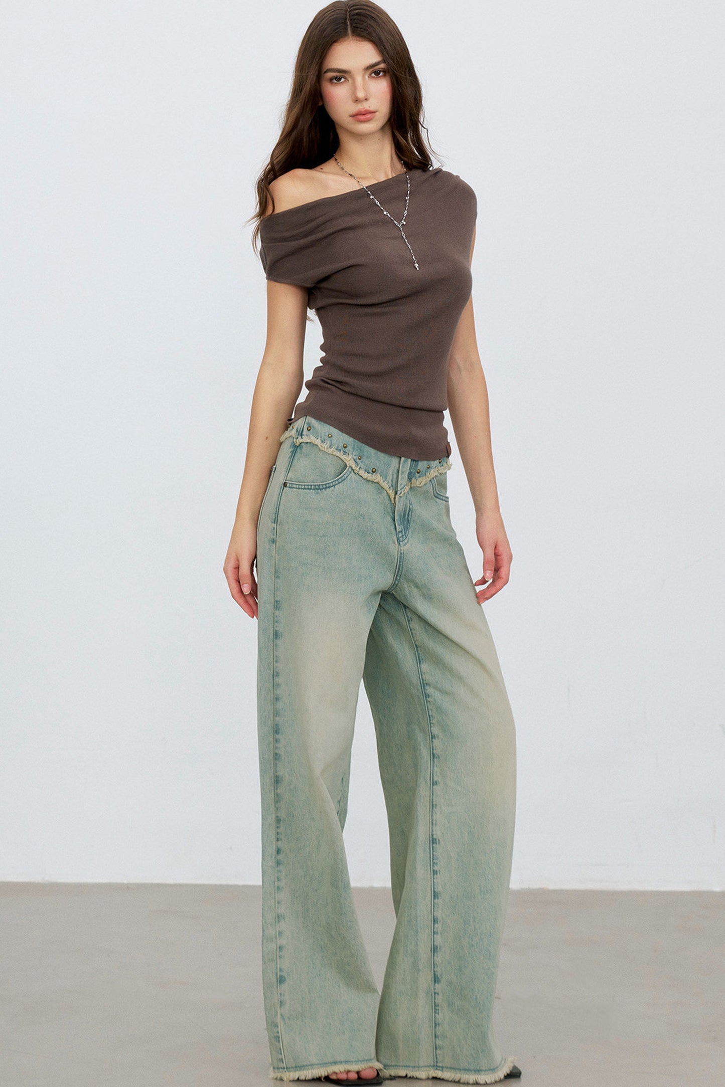 V-Shaped Raw Edge Rivet Denim Pants
