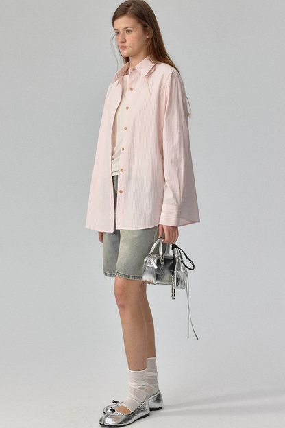 Blusa a rayas con textura y hombros caídos
