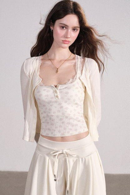 Completo con cardigan smanicato e pantaloni eleganti