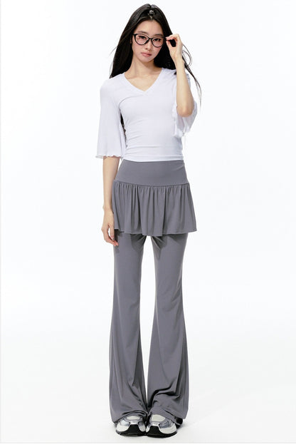 Completo rosa con top a maniche a campana e pantaloni da yoga