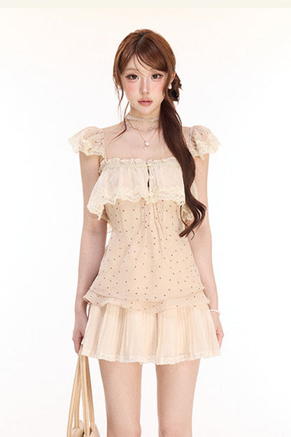 Completo con top in pizzo a pois e gonna plissettata in chiffon