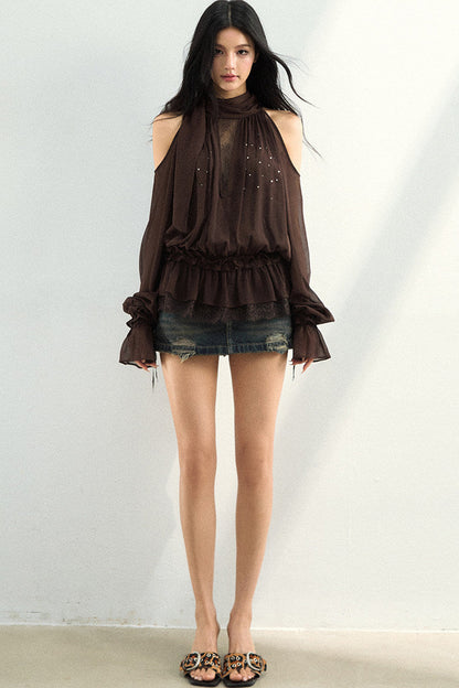 Blusa in tessuto velato e rete con strass