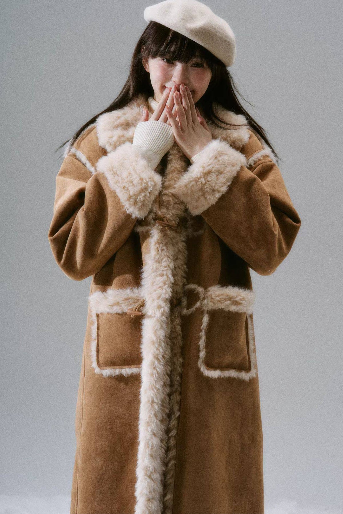Manteau long à boutons en corne