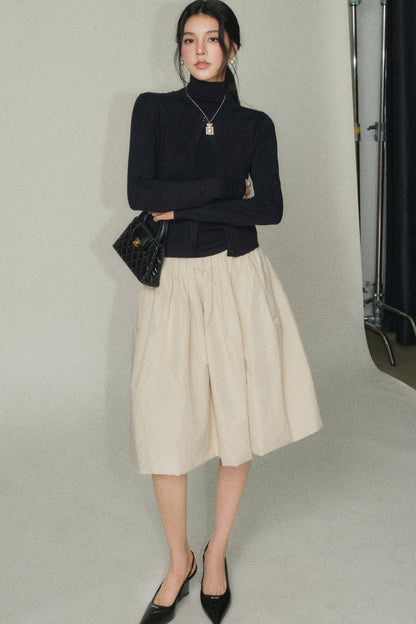 Completo nero in lana con gilet e cardigan