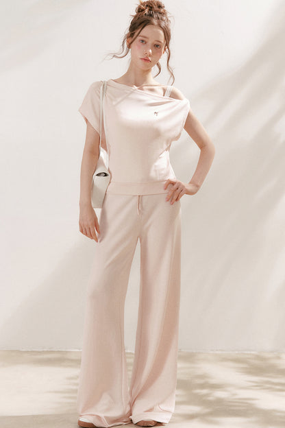 Conjunto de camiseta asimétrica y pantalones de capa de aire