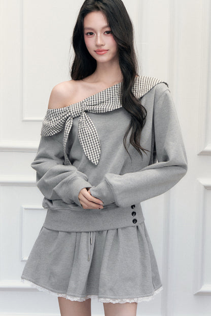 Ensemble sweatshirt épaules dénudées et jupe patchwork à carreaux
