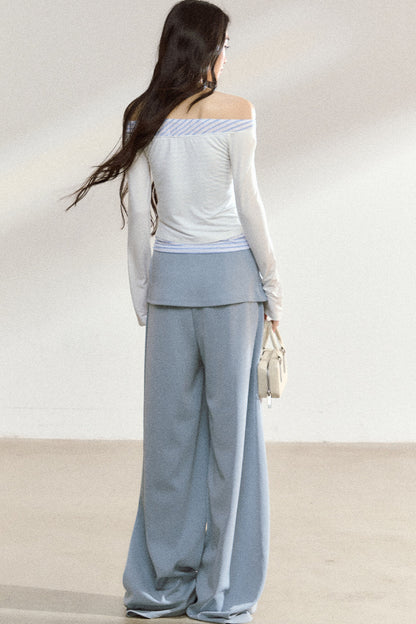 Completo con top a maniche lunghe con spalle scoperte e pantaloni ampi