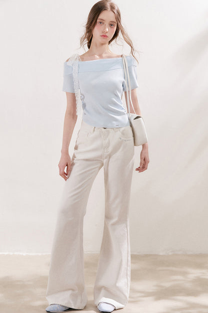 Top in maglia con spalle scoperte e fiocco in pizzo