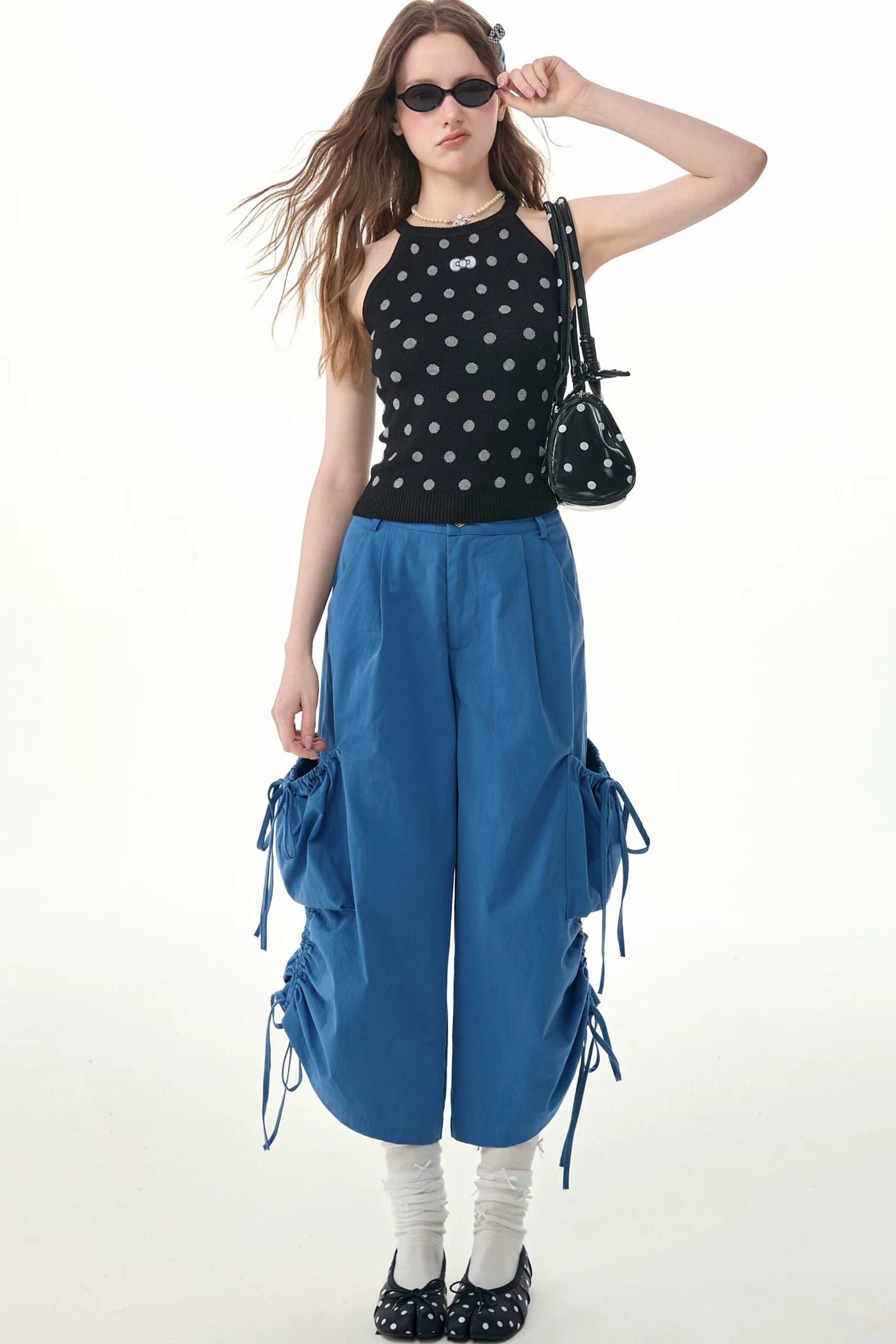 Top all’americana in maglia nero a pois