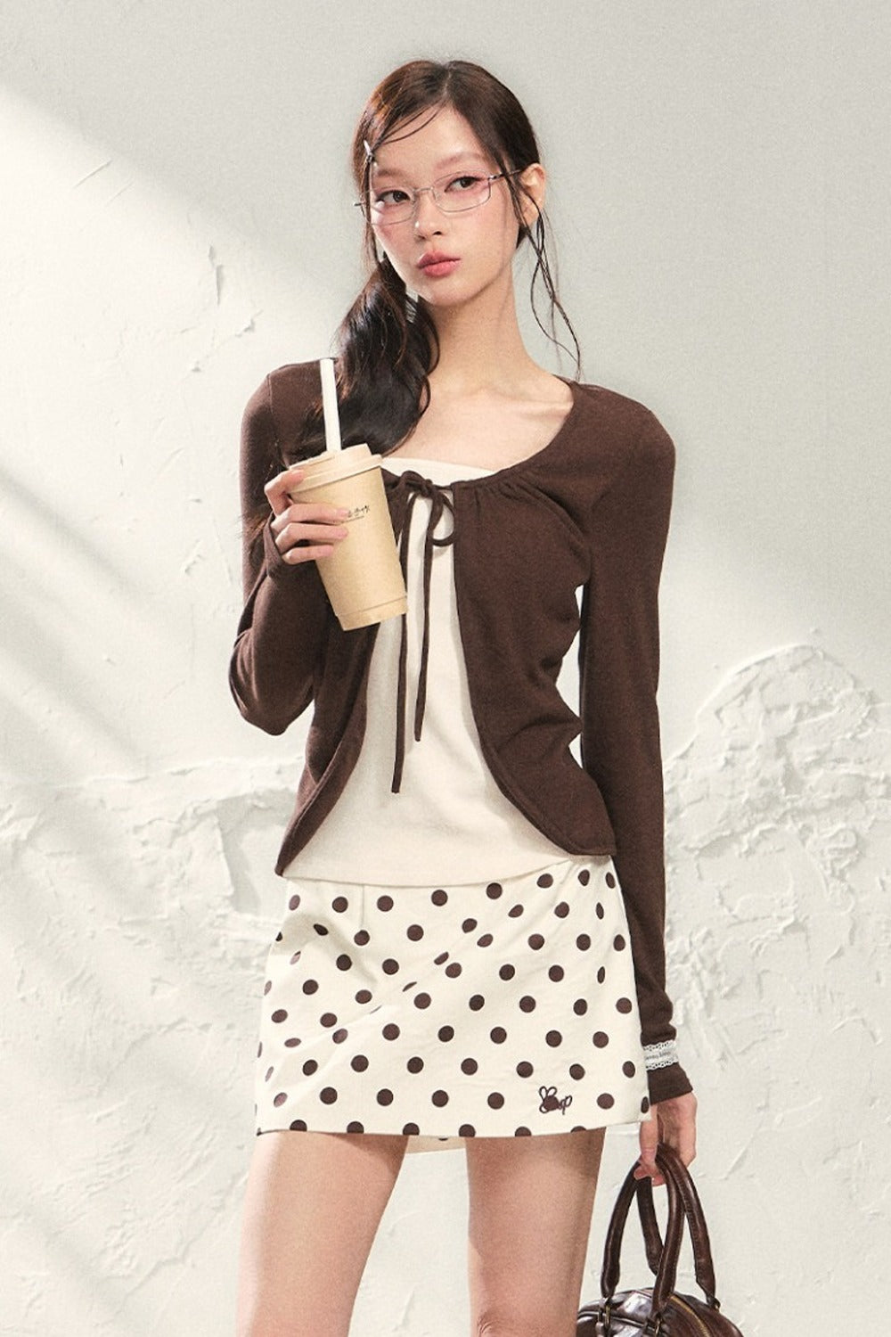 Conjunto de top de punto de manga larga y falda