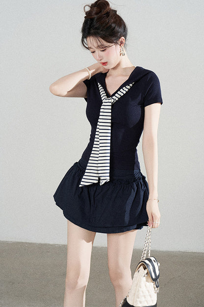 Ensemble tee-shirt châle à manches courtes en maille bleu marine et jupe