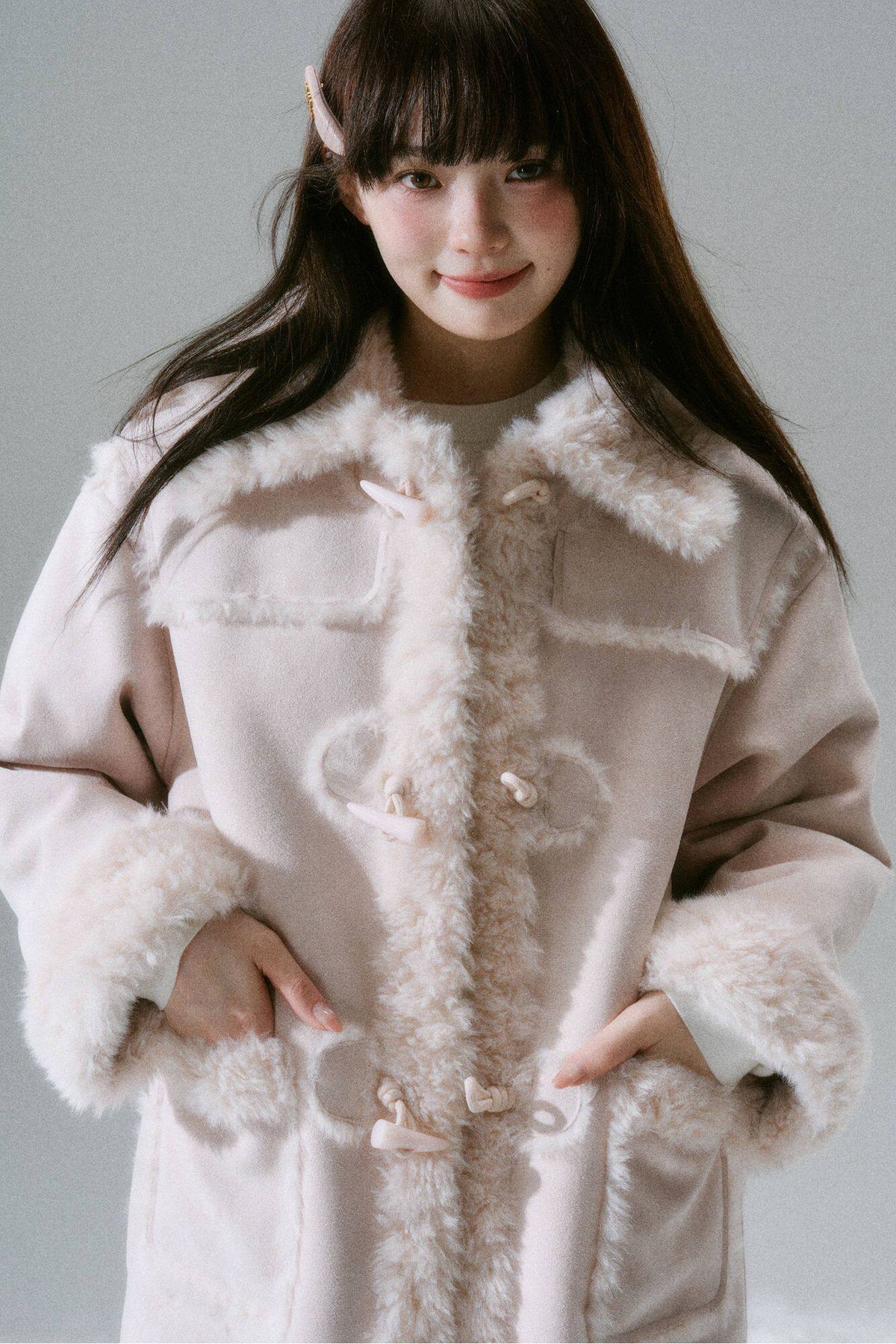 Manteau long à boutons en corne