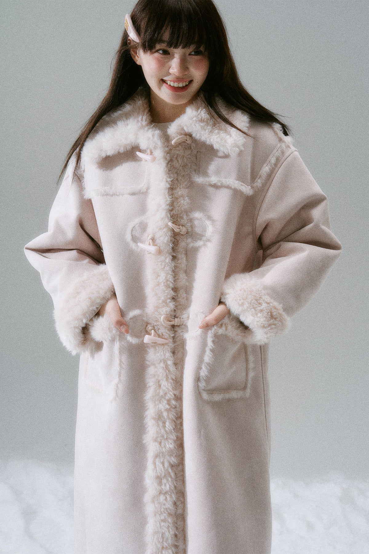 Manteau long à boutons en corne
