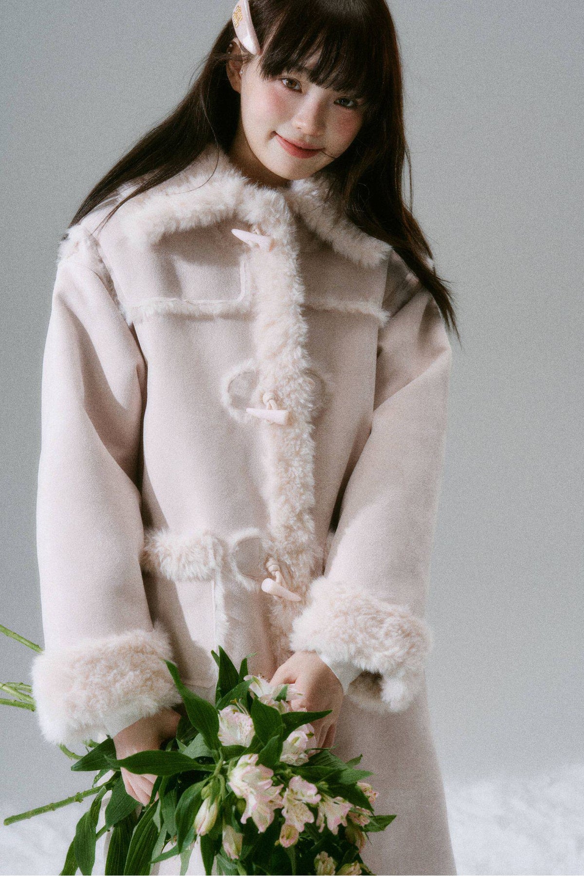 Manteau long à boutons en corne