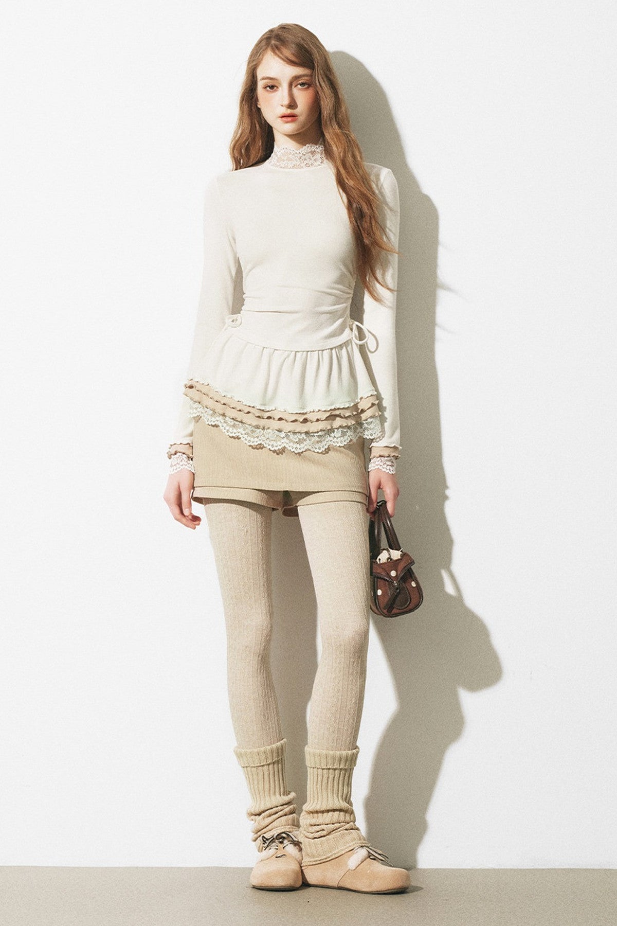 Top a maglia slim fit con bordo in pizzo