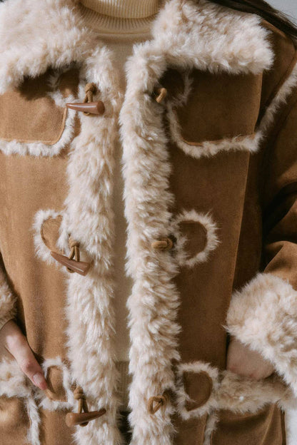 Manteau long à boutons en corne