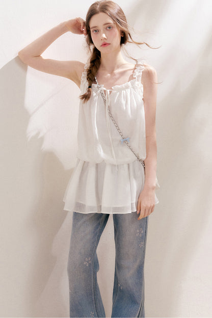 Jean en denim bleu avec fleur à cinq pétales en strass