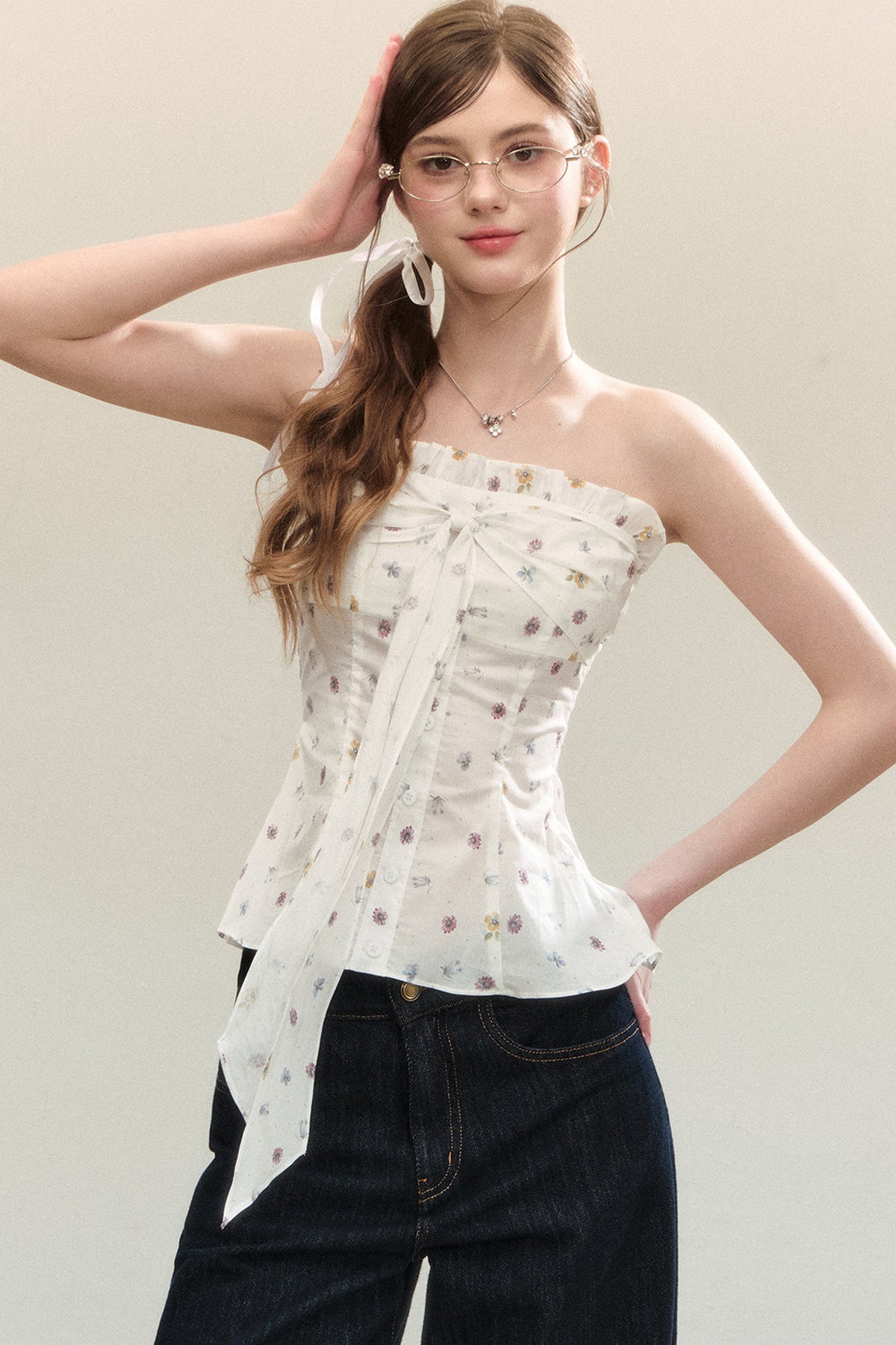 Top a fascia con peplo e fiocco