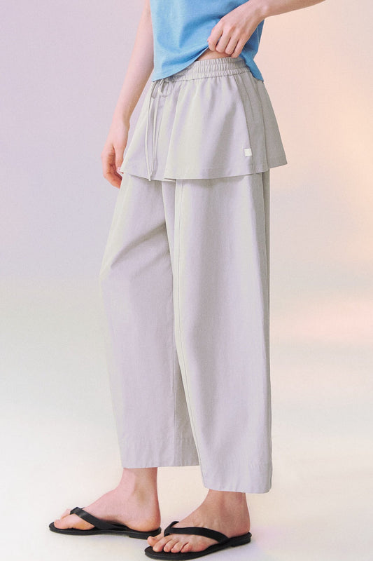 Pantalon large avec jupe superposée effet superposition