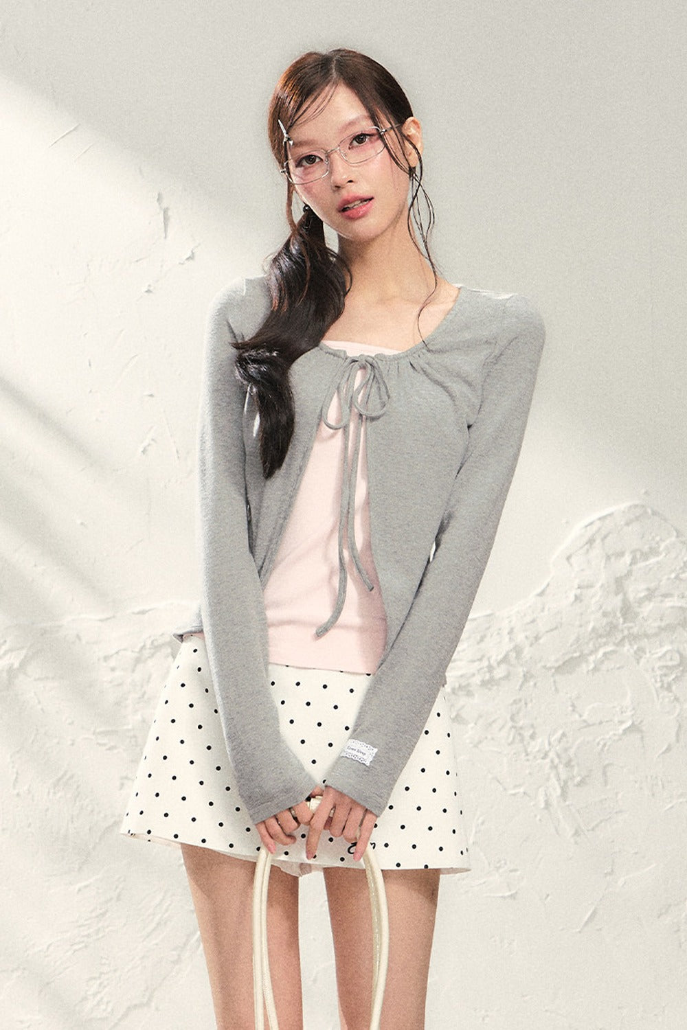Conjunto de top de punto de manga larga y falda
