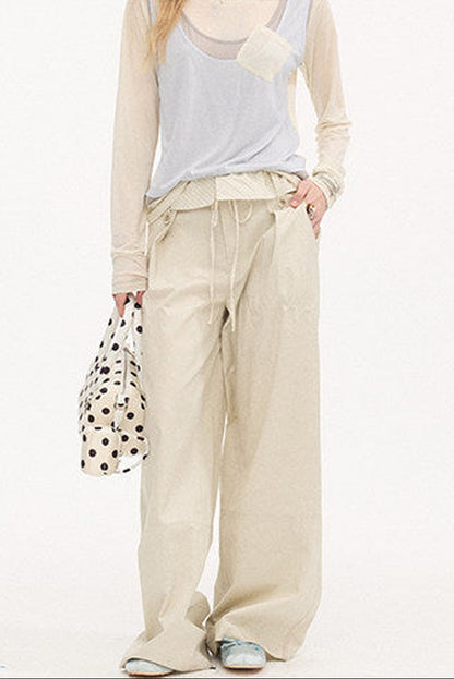 Pantalon droit à rayures et empiècements