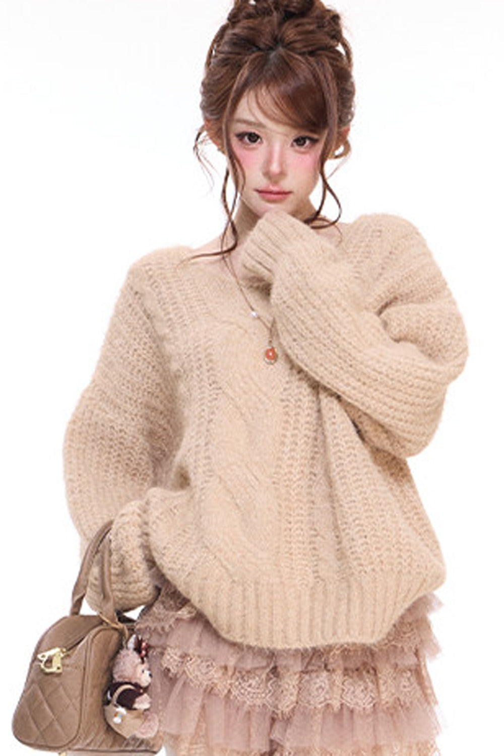 Pull ample en maille torsadée à col V