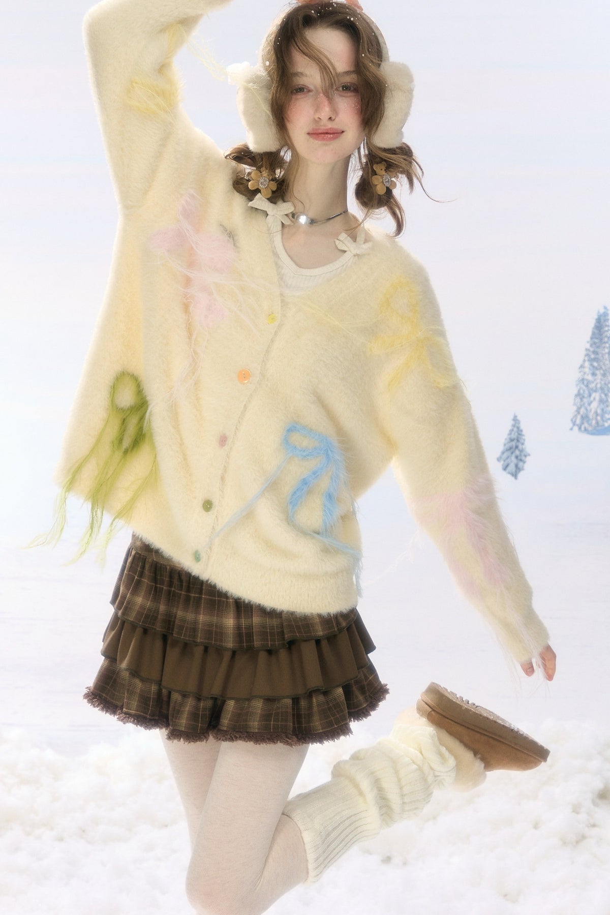 Cardigan in maglia soffice color albicocca con fiocco