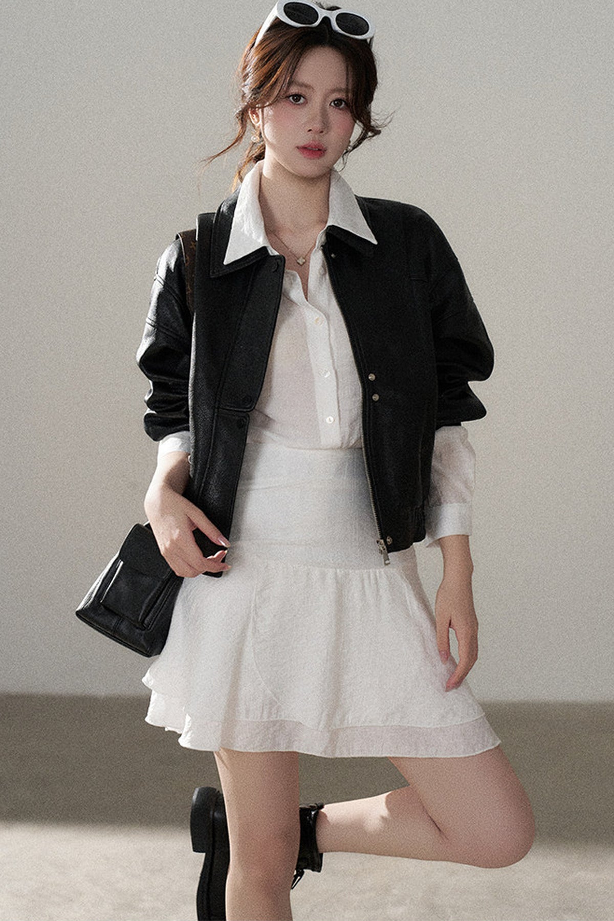 Giacca corta in pelle PU con revers