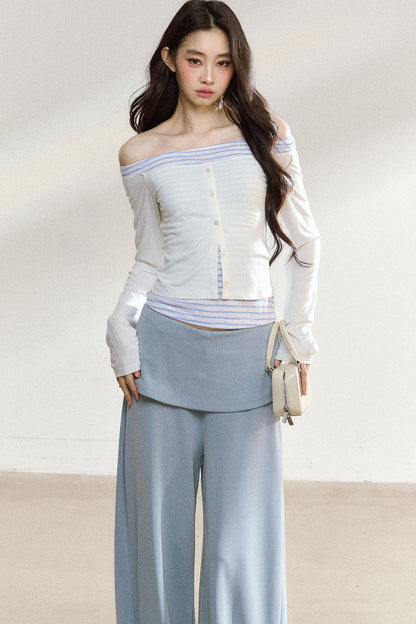 Completo con top a maniche lunghe con spalle scoperte e pantaloni ampi