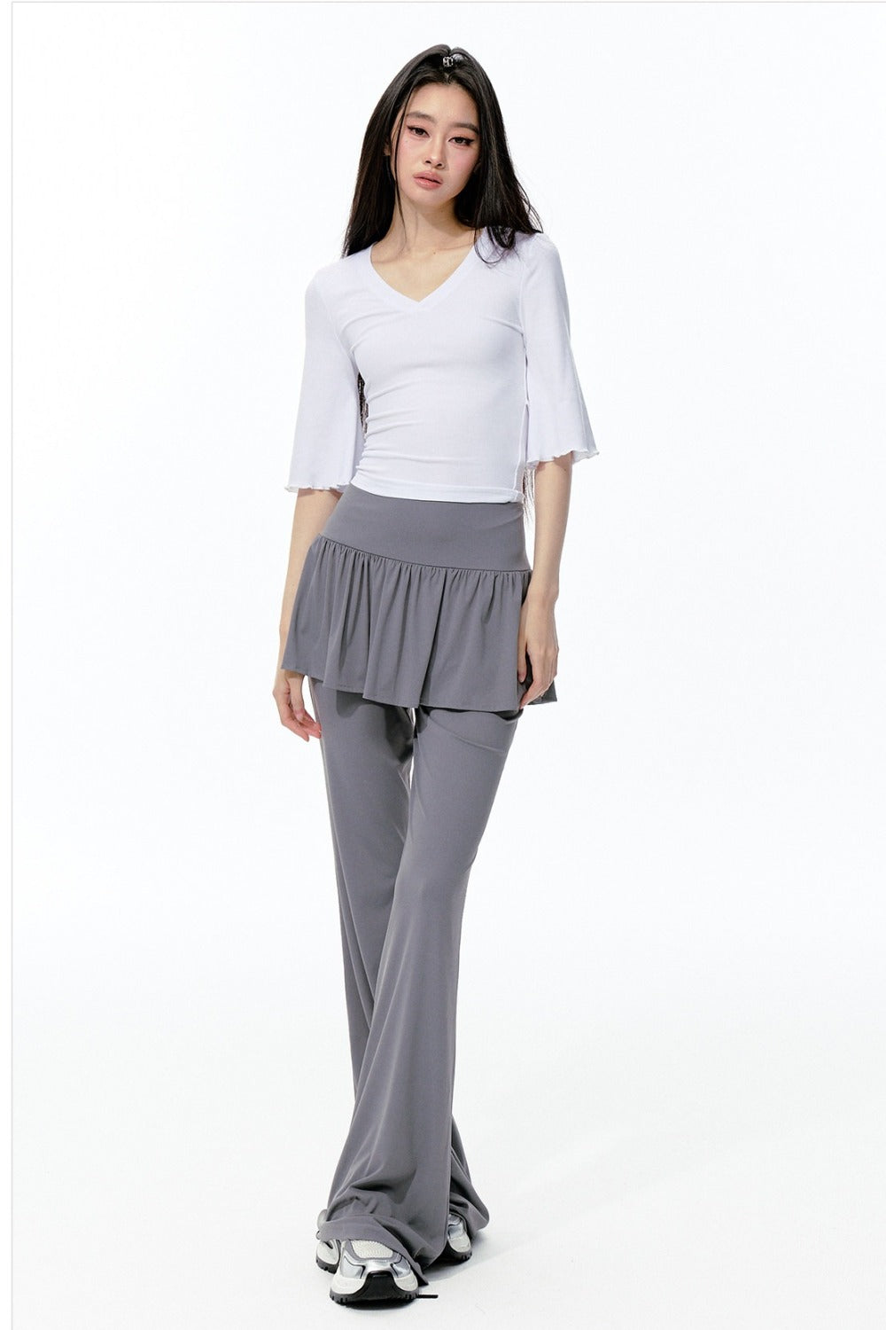 Completo rosa con top a maniche a campana e pantaloni da yoga