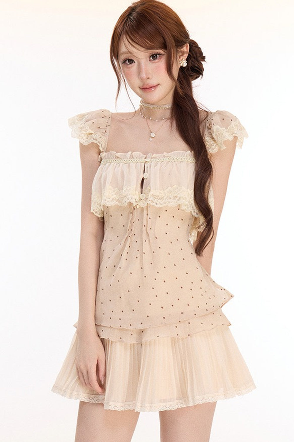 Completo con top in pizzo a pois e gonna plissettata in chiffon