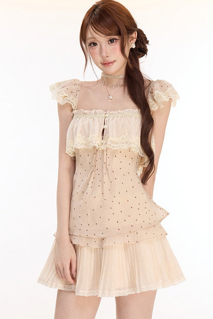 Completo con top in pizzo a pois e gonna plissettata in chiffon