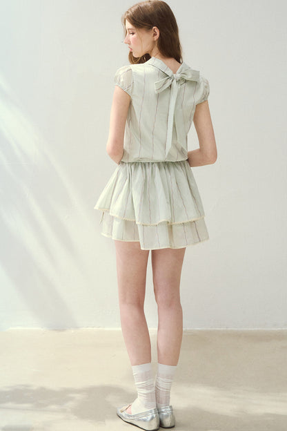 Lyocell-Spitzenkleid mit Biesenfalten und halbhohem Kragen