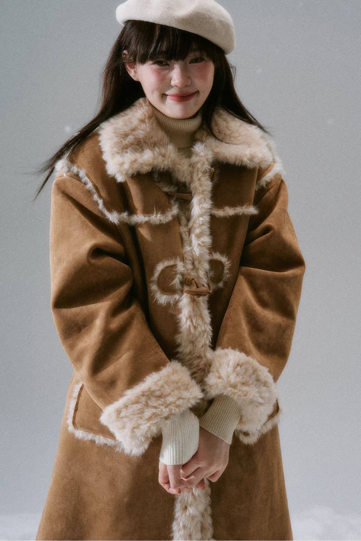 Manteau long à boutons en corne