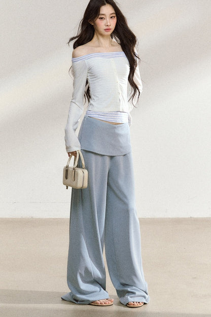 Completo con top a maniche lunghe con spalle scoperte e pantaloni ampi