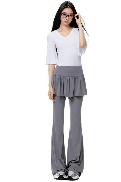 Completo rosa con top a maniche a campana e pantaloni da yoga