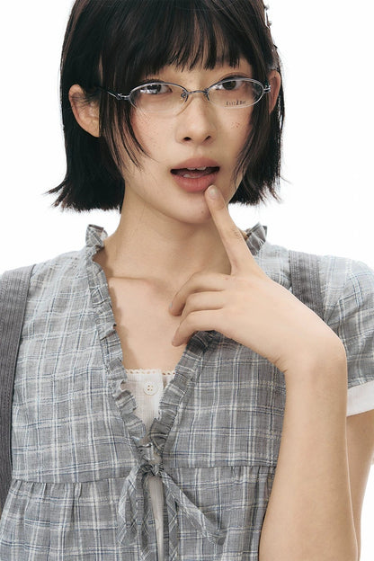 Camicia a quadri con volant e scollo a V
