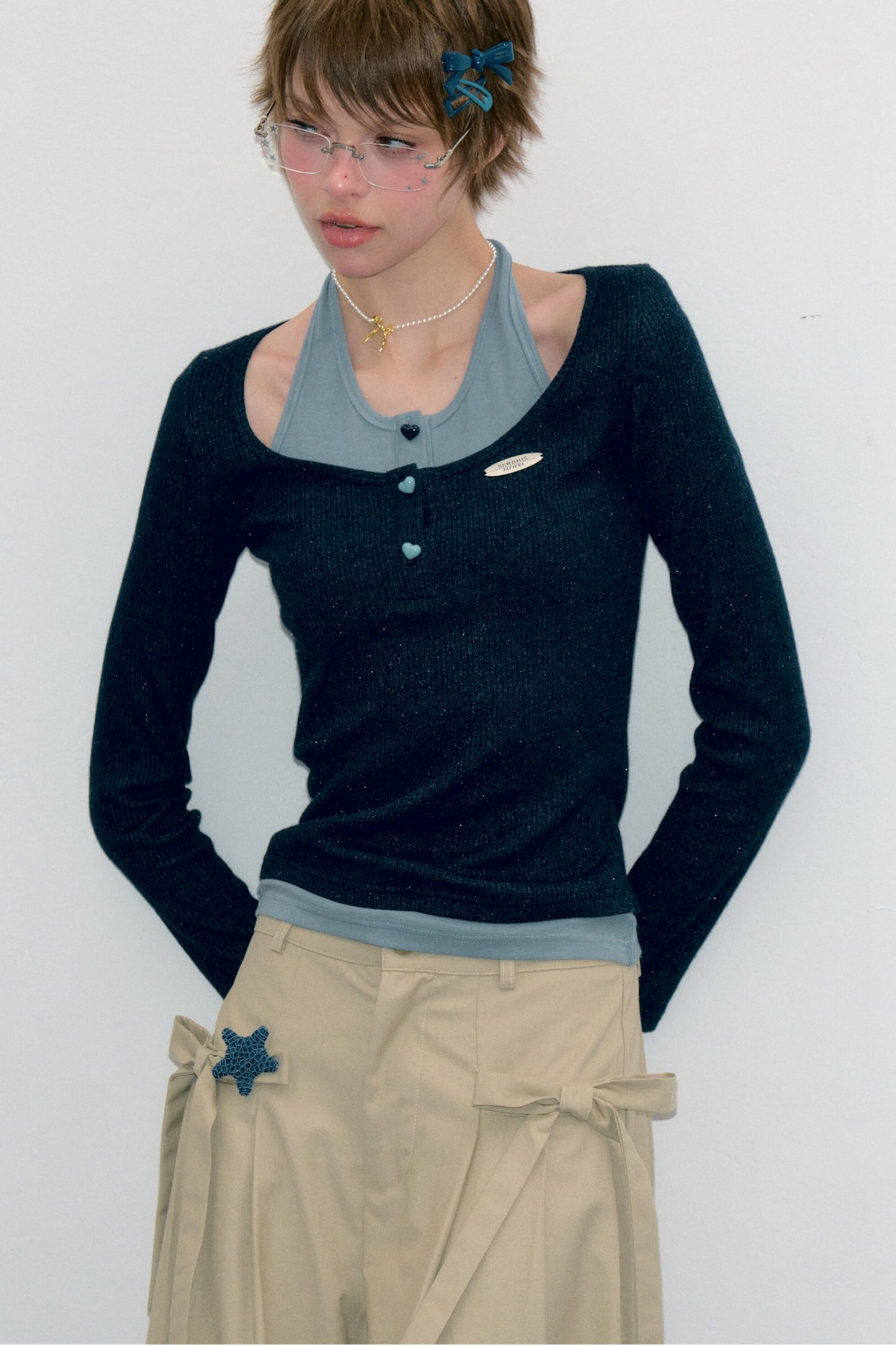Top in maglia blu a maniche lunghe effetto stratificato