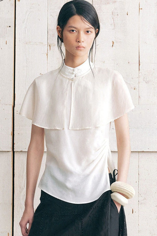 Camicia senza maniche con mantellina removibile