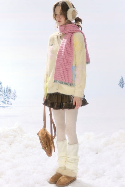 Cardigan in maglia soffice color albicocca con fiocco