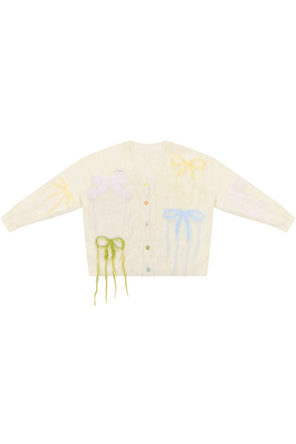 Cardigan in maglia soffice color albicocca con fiocco