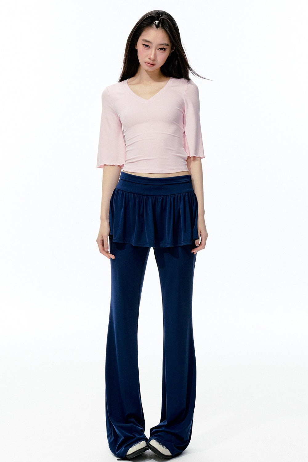 Completo rosa con top a maniche a campana e pantaloni da yoga