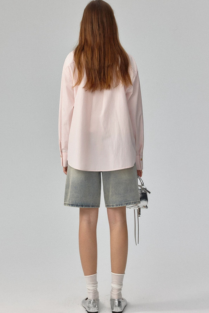 Blusa a rayas con textura y hombros caídos