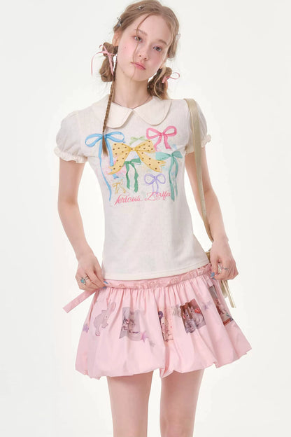 T-shirt bianca con maniche a sbuffo e stampa con fiocchi