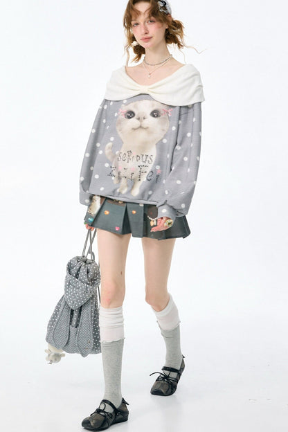 Sudadera gris con estampado de gato y lunares